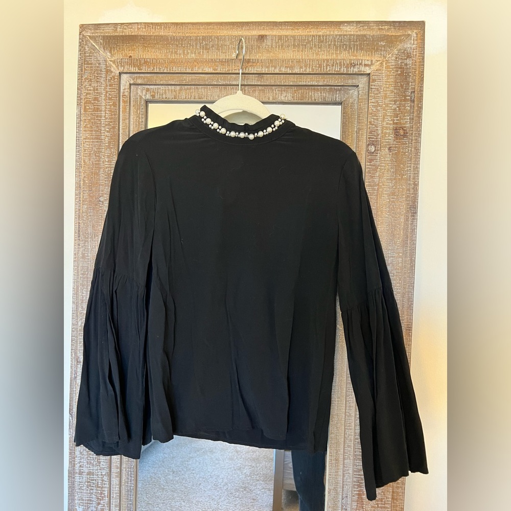 Black long sleeve pearl neck blouse. Size M.